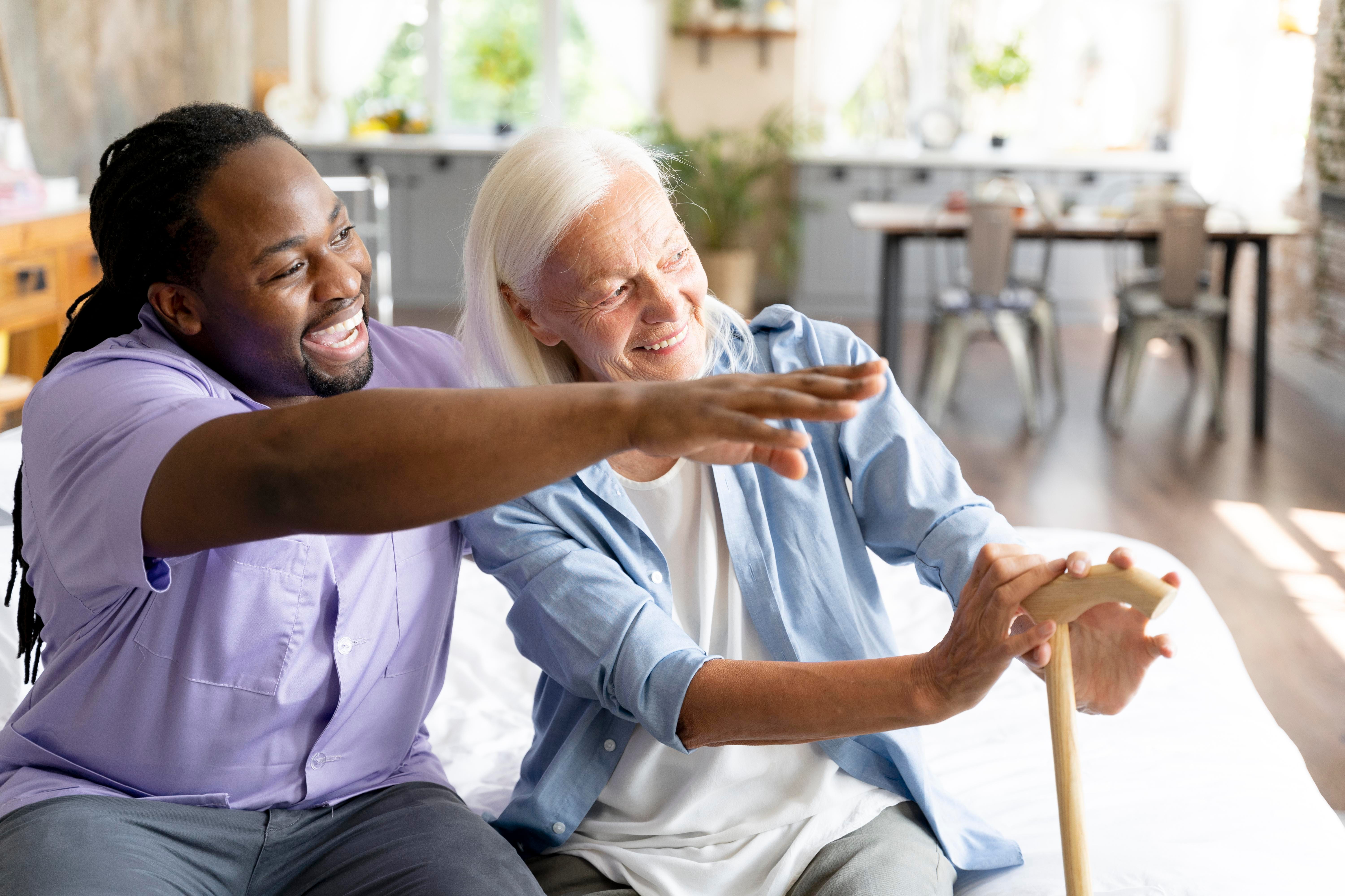 Care professional supporting an older adult